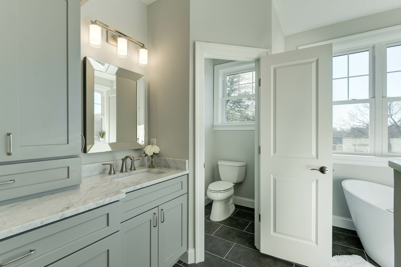 Compact stylish bathroom maximizing every space into a functional area