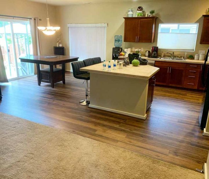 Modern Kitchen Flooring using laminated flooring with advantages of being resistant to scratches, stains, and fading